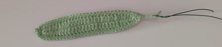 Completed green crochet calla lily leaf with wire