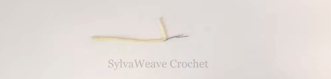 Yellow yarn wrapped around folded wire for a hibiscus flower center