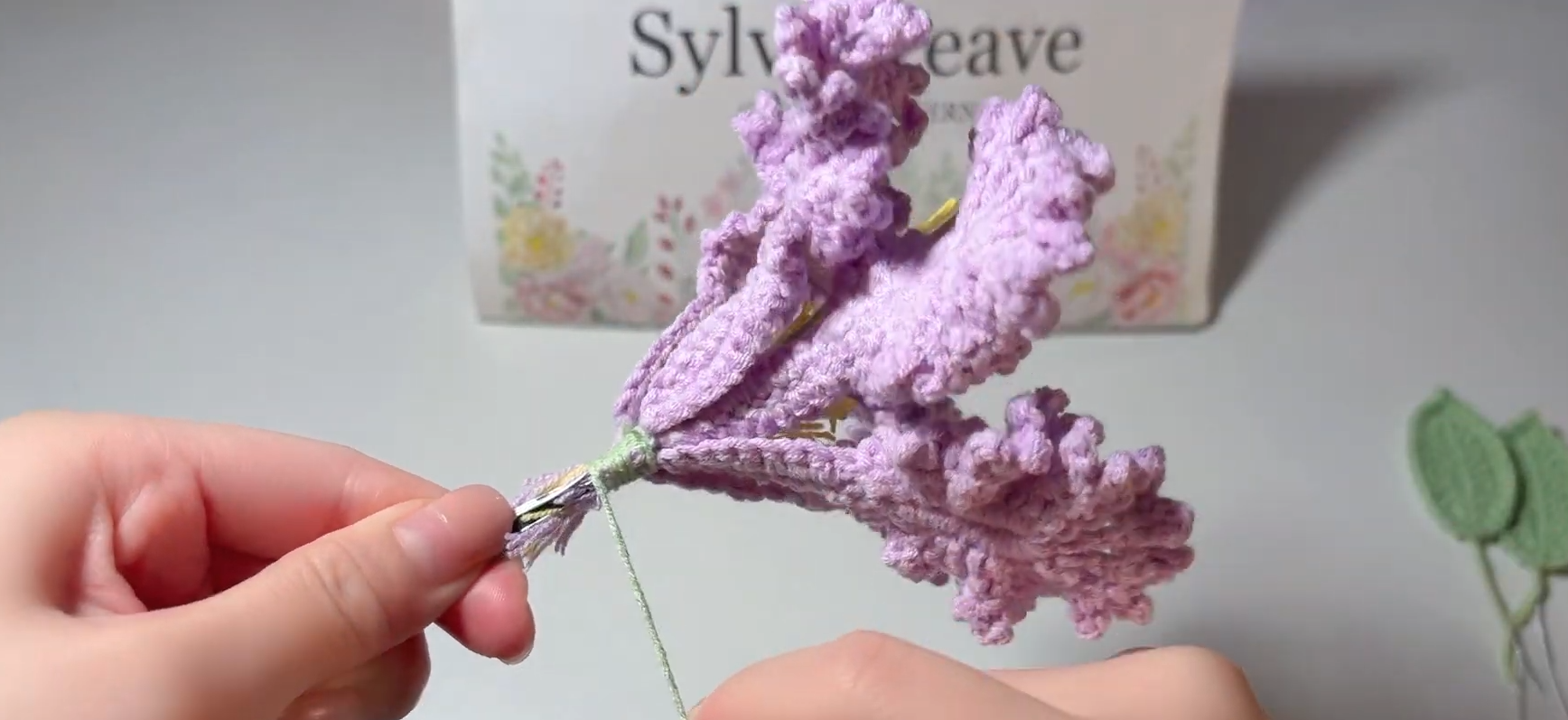 Attaching purple crochet Crape Myrtle petals around the flower centre